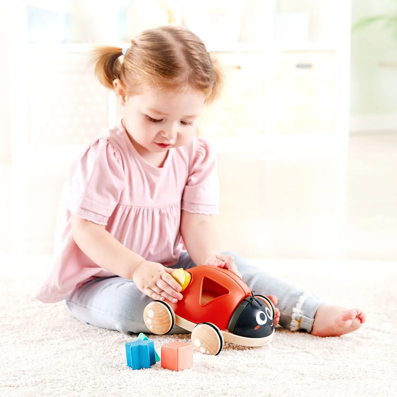 Игрушка каталка-сортер Hape «Божья коровка», 5 предметов